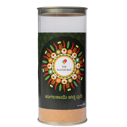 The Flavor Bag Bitter Gourd Chutney Powder in a clear cylindrical container with a decorative spice-themed label