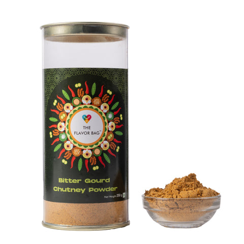 The Flavor Bag Bitter Gourd Chutney Powder in a clear cylindrical container with a small bowl of the spice blend.