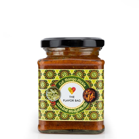 The Flavor Bag Cut Mango Pickle in a glass jar with a black lid, featuring a traditional South Indian recipe.