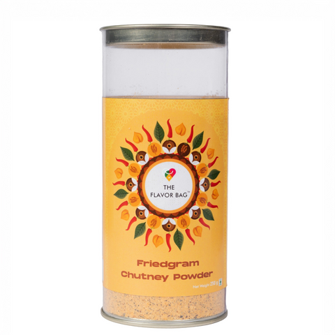 The Flavor Bag Fried Gram Chutney Powder in a clear cylindrical container with a yellow decorative label.