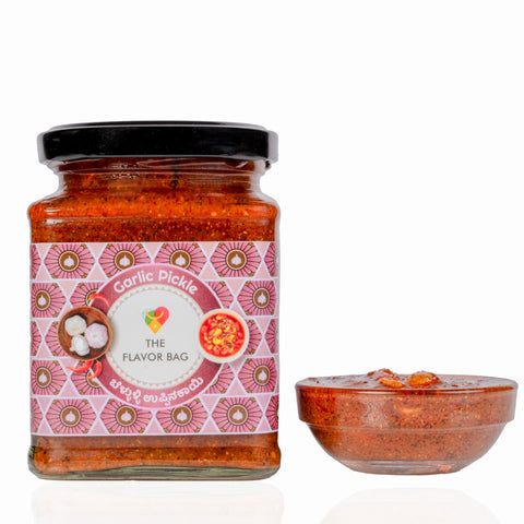 The Flavor Bag Garlic Chutney in a glass jar with a small bowl of spicy red condiment on a white background.