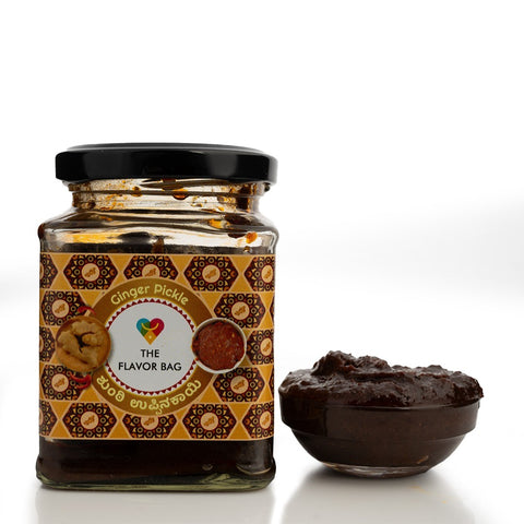 The Flavor Bag ginger chutney in a glass jar with a small bowl of chutney beside it. Traditional South Indian preparation.