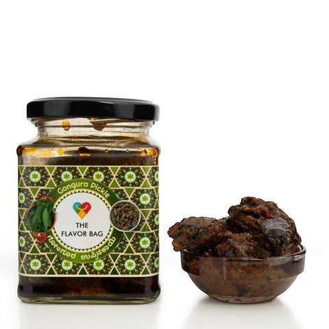 The Flavor Bag Gongura Pickle, a rich, thick South Indian chutney in a glass jar with a small bowl of pickle beside it.