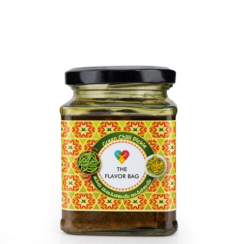 The Flavor Bag Green Chilli Pickle in a glass jar with a black lid, featuring a vibrant label with green chillies and spices.