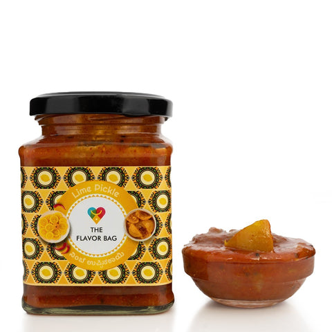 The Flavor Bag Lime Pickle in a glass jar with a small bowl of pickle. Authentic South Indian recipe.