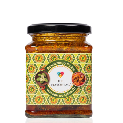 The Flavor Bag Mango Avakai Pickle in a glass jar with a decorative label featuring traditional Indian patterns.