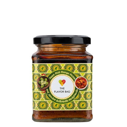 The Flavor Bag Appe Midi Mango Pickle in a glass jar with a black lid. Traditional South Indian pickle.