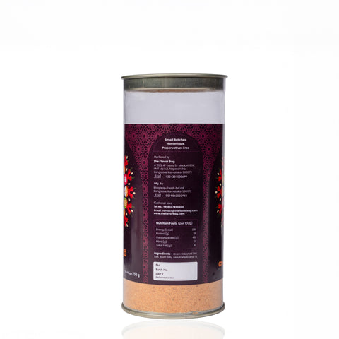 The Flavor Bag Molaga Podi spice mix in a clear cylindrical container with a detailed nutritional information label.