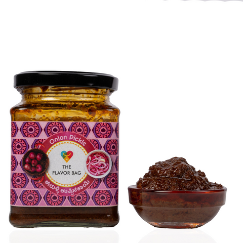 The Flavor Bag Onion Chutney in a glass jar with a patterned label next to a small bowl of the dark brown condiment.
