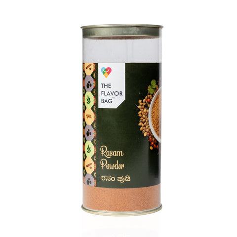 The Flavor Bag Karnataka-style Rasam Powder in a clear cylindrical spice container with a black label.