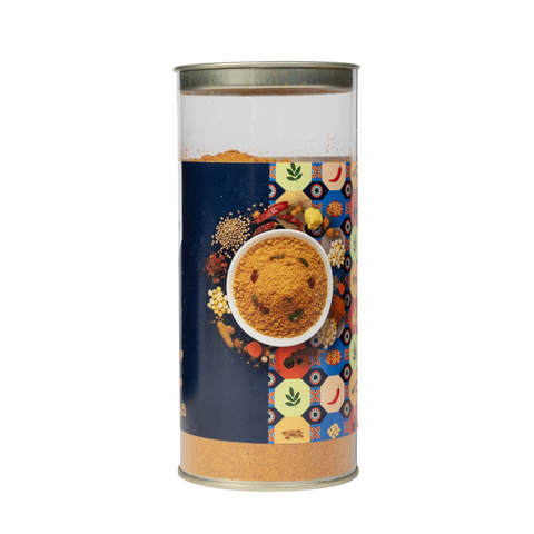 The Flavor Bag Karnataka-style Sambar Powder in a clear cylindrical container with a colourful patterned label