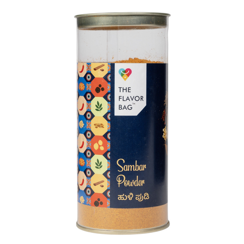 The Flavor Bag Karnataka-style Sambar Powder in a clear cylindrical container with a decorative spice label