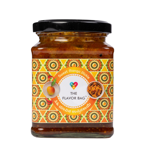 The Flavor Bag Sweet Mango Pickle in a glass jar with a vibrant patterned label featuring traditional Indian motifs.