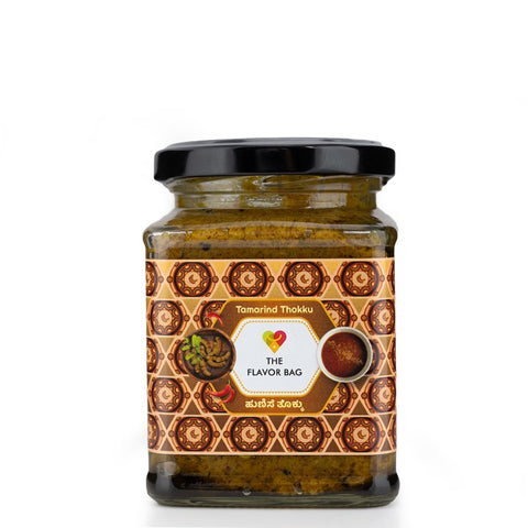 The Flavor Bag Tamarind Thokku, a thick, flavourful South Indian chutney in a glass jar, perfect with rice or dosa.
