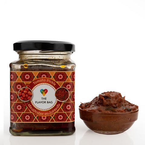 The Flavor Bag Tomato Chutney in a glass jar with a traditional Indian pattern label. Served in a small bowl.
