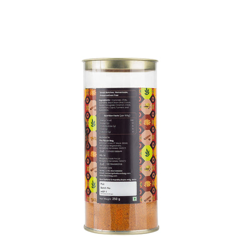 The Flavor Bag Vangibath Powder, a traditional South Indian spice blend in a clear jar, featuring roasted spices for authentic home-style flavour.